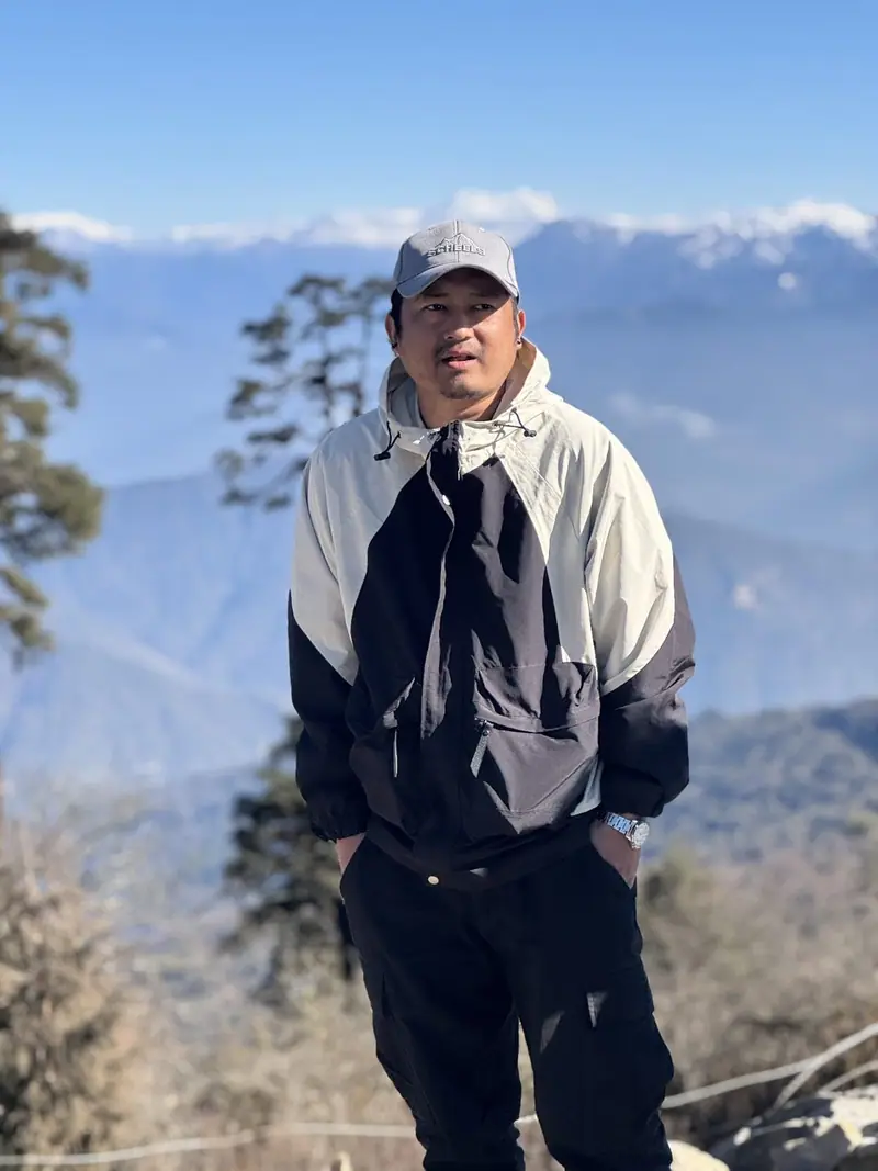 Portrait of Deepraj Rai in the mountains